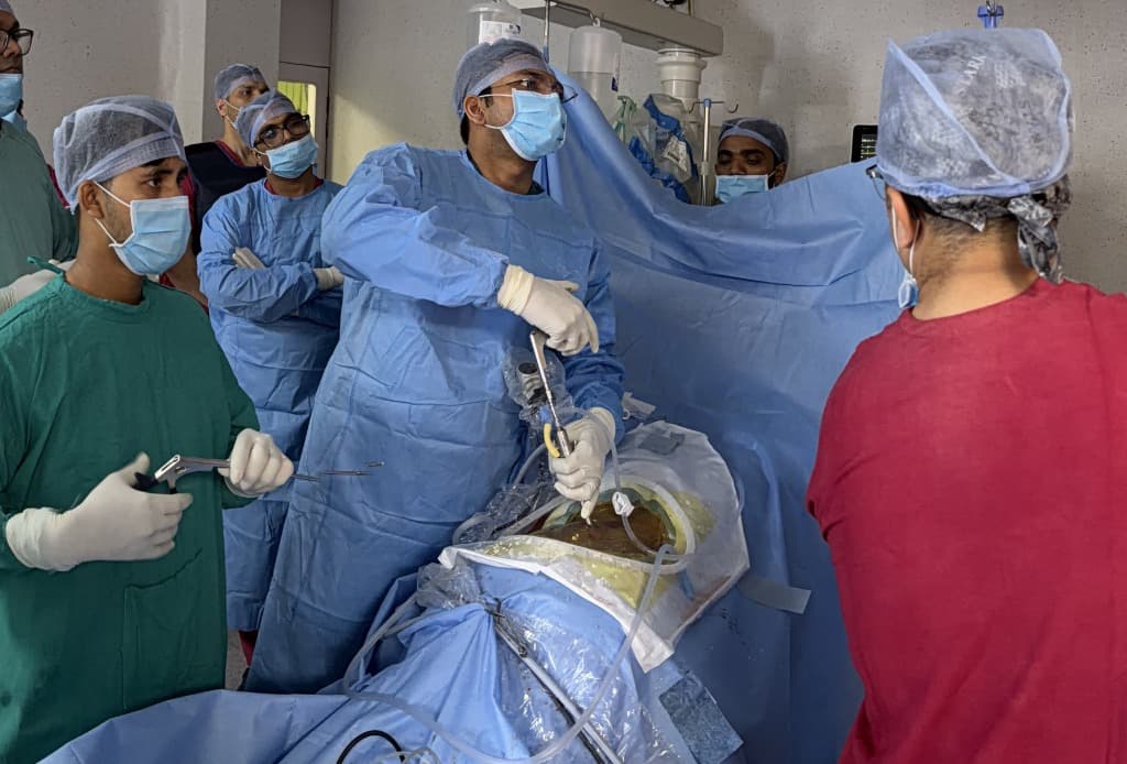 Dr. Achal Gupta performing actual Endoscopic Spine Surgery in Operation Theatre
