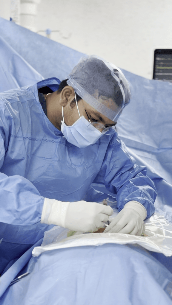 Dr. Achal Gupta performing Endoscopic Spine Surgery under high definition magnification
